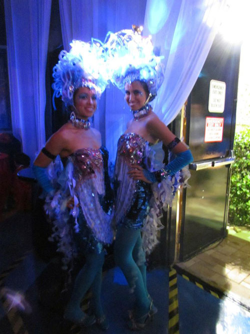 Illuminated Costumes and Strolling Human Tables